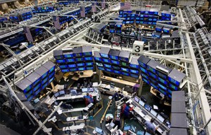 High-angle view of a vast, modern stock exchange or trading floor.