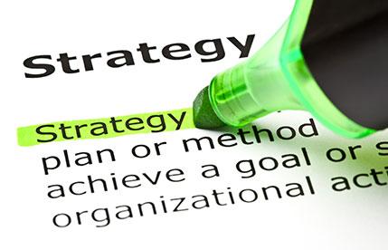 Green marker highlighting the word "Strategy" in a dictionary definition.
