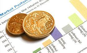 Australian dollar coin resting on a printed financial report with a bar graph.