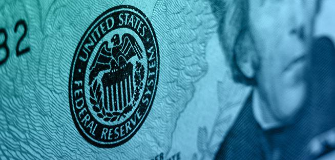 Newspaper headline asking, "What US Government Shutdown means for investors."