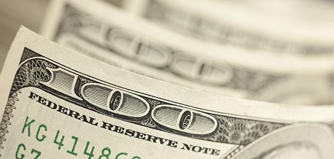 Extreme close-up of a US one-hundred-dollar bill.