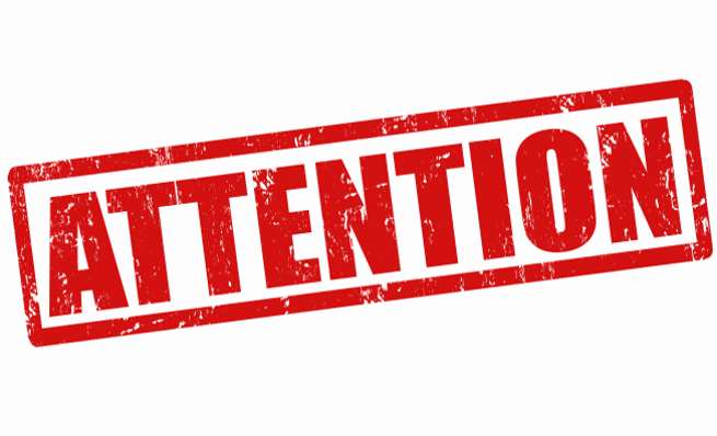 Bold red rubber stamp graphic reading "ATTENTION."