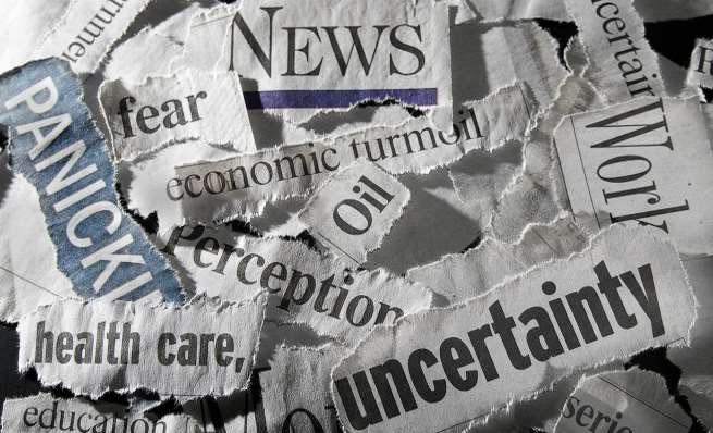 A black and white newspaper clipping with a faded headline on a stock market-related news story.