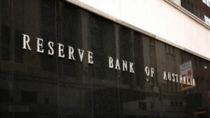 A close-up view of the exterior of a building featuring the engraved or metal lettering "RESERVE BANK OF AUSTRALIA" on its dark, glossy granite facade.